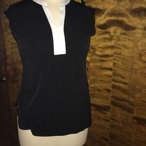Black and white sleeveless blouse